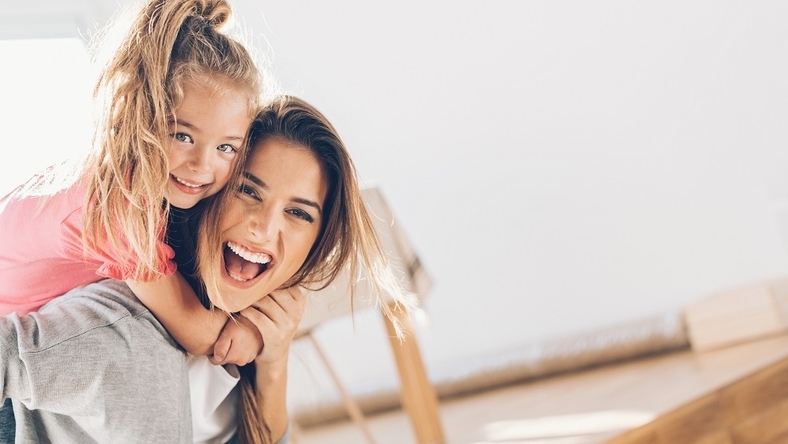 Mom playing with young daughter 