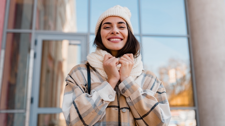 Woman smiling outside winter